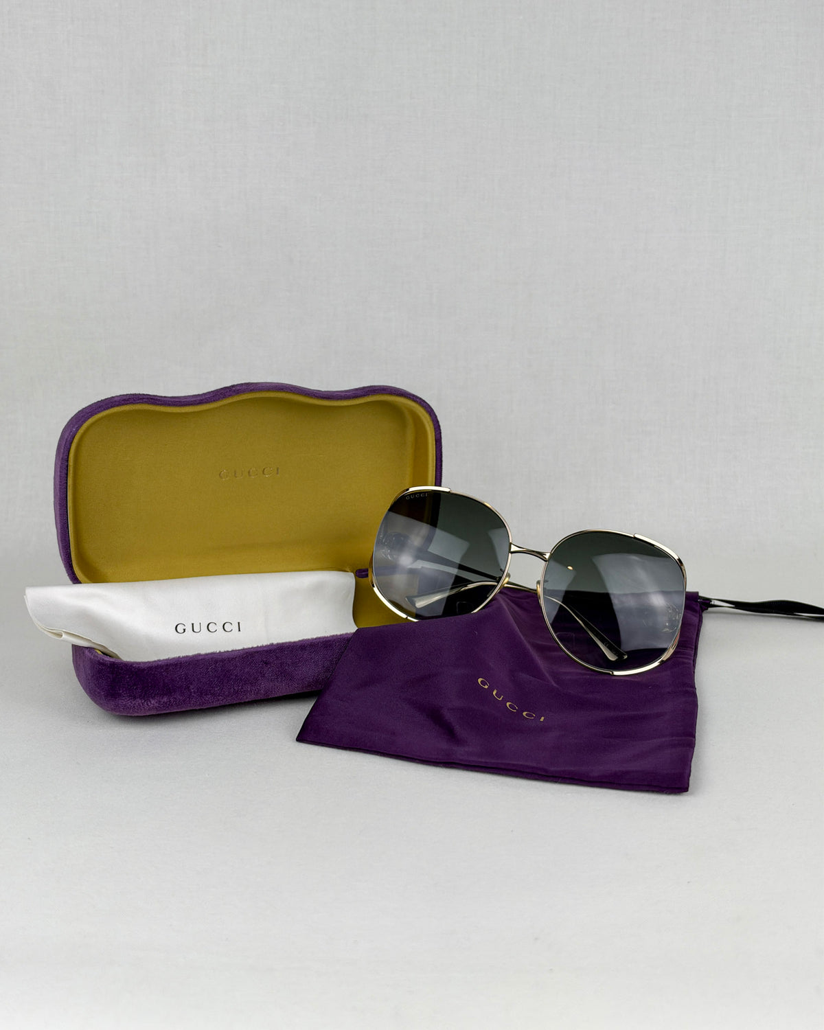 Gucci GG0225S Gold Metal Sunglasses – Gray Gradient